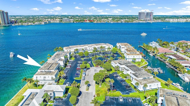 drone / aerial view featuring a water view and a city view