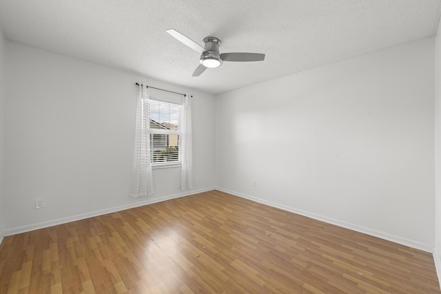 10531 NW 57th St, Coral Springs, FL 33076 - unfurnished room featuring light wood-type flooring, a ceiling fan, a textured ceiling, and baseboards
