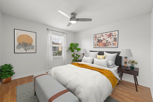 10531 NW 57th St, Coral Springs, FL 33076 - bedroom with light wood-style flooring, a textured ceiling, baseboards, and a ceiling fan