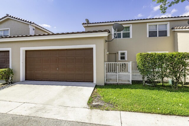 10531 NW 57th St, Coral Springs, FL 33076 - view of front of house featuring driveway, an attached garage, stucco siding, and fence