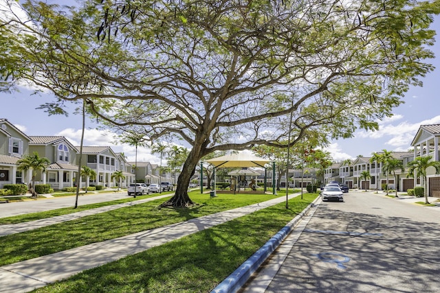 10531 NW 57th St, Coral Springs, FL 33076 - view of home's community with a residential view and a lawn