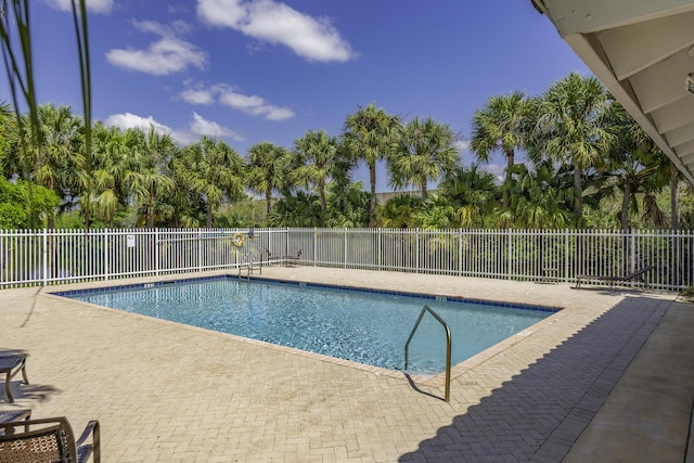 10531 NW 57th St, Coral Springs, FL 33076 - community pool featuring a patio and fence