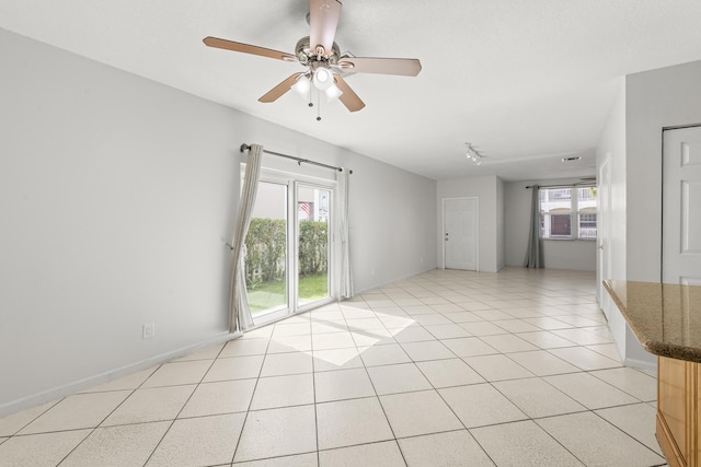 10531 NW 57th St, Coral Springs, FL 33076 - spare room featuring plenty of natural light, ceiling fan, and light tile patterned flooring