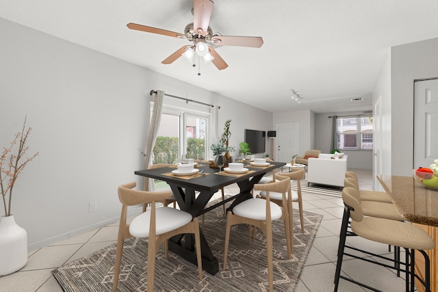 10531 NW 57th St, Coral Springs, FL 33076 - dining room featuring ceiling fan, light tile patterned floors, and baseboards