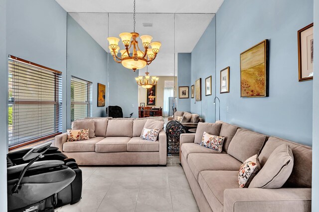 kitchen featuring a sink, wall chimney exhaust hood, stainless steel appliances, a peninsula, and visible vents