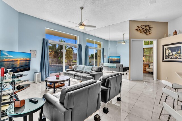 bedroom with ceiling fan, light tile patterned flooring, and access to exterior