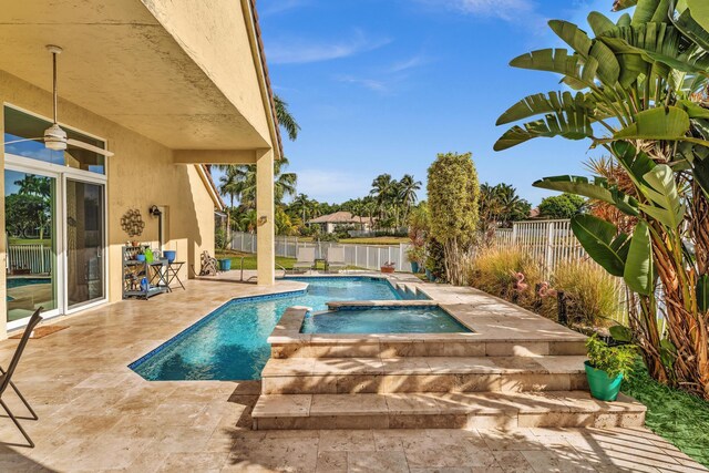 view of swimming pool with ceiling fan, a fenced backyard, a fenced in pool, an in ground hot tub, and a patio area