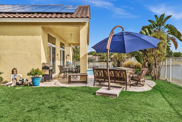 view of yard with a fenced in pool, outdoor dining area, a fenced backyard, and a patio area
