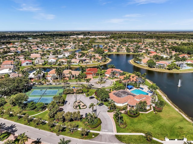 drone / aerial view featuring a water view and a residential view