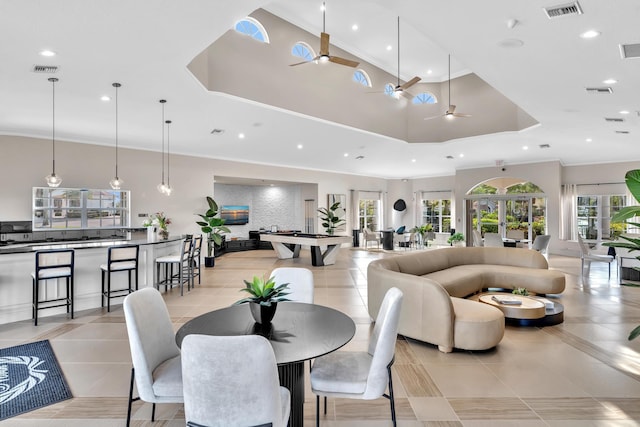 19323 King Palm Ct, Boca Raton, FL 33498 - dining area featuring healthy amount of natural light, a tray ceiling, light tile patterned floors, recessed lighting, and ornamental molding