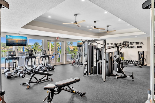 19323 King Palm Ct, Boca Raton, FL 33498 - exercise room featuring a tray ceiling, a textured ceiling, recessed lighting, and ceiling fan