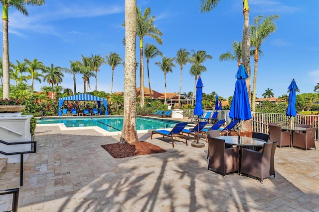 19323 King Palm Ct, Boca Raton, FL 33498 - community pool featuring a patio, a gazebo, and outdoor dining area