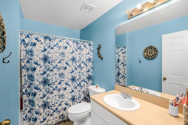 bathroom featuring visible vents, a shower with curtain, toilet, and vanity