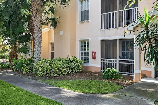doorway to property with stucco siding