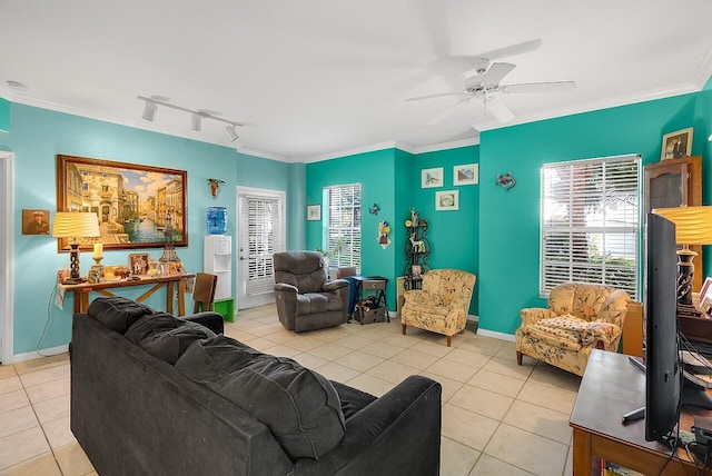 living room featuring rail lighting, ornamental molding, ceiling fan, and tile patterned flooring
