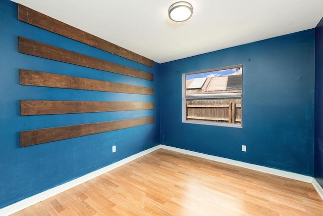 2650 SW Acco Rd, Port Saint Lucie, FL 34953 - unfurnished room featuring baseboards and wood finished floors