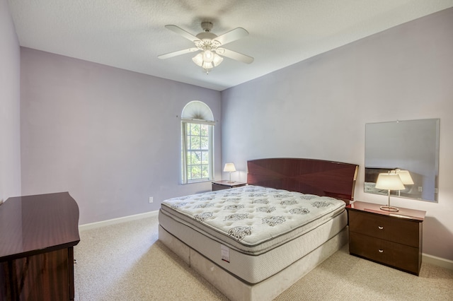 606 SW Treasure Cv, Port Saint Lucie, FL 34986 - bedroom with light colored carpet, baseboards, and ceiling fan