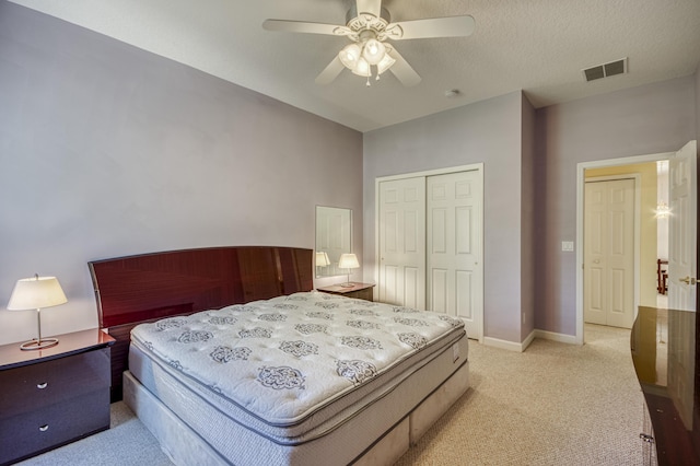 606 SW Treasure Cv, Port Saint Lucie, FL 34986 - bedroom with light colored carpet, a closet, ceiling fan, and baseboards