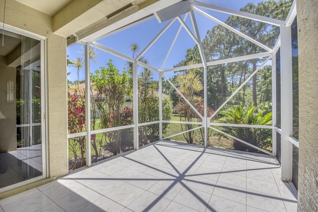 606 SW Treasure Cv, Port Saint Lucie, FL 34986 - unfurnished sunroom featuring lofted ceiling