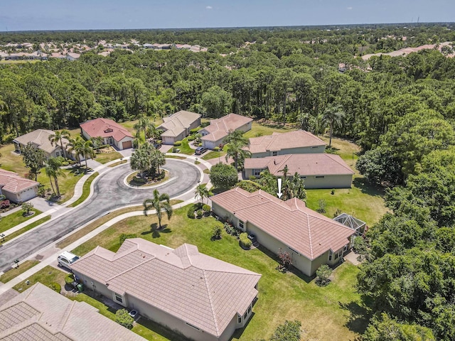 606 SW Treasure Cv, Port Saint Lucie, FL 34986 - aerial view of residential area featuring a heavily wooded area