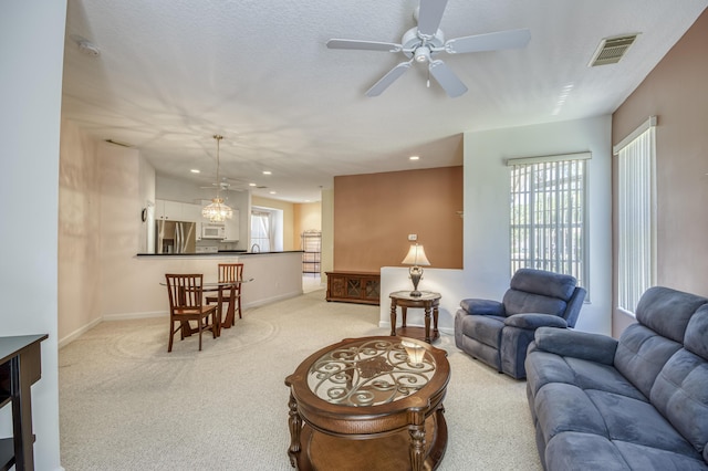 606 SW Treasure Cv, Port Saint Lucie, FL 34986 - living room with light carpet, a ceiling fan, baseboards, and recessed lighting