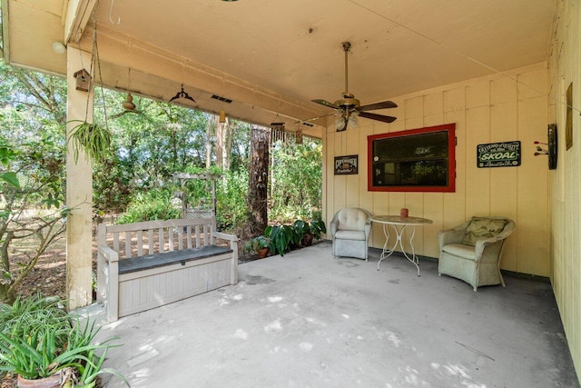 view of patio with a ceiling fan and visible vents