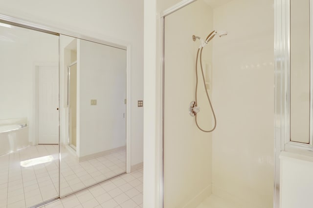 17288 Shoals Dr, Jupiter, FL 33477 - full bath featuring a shower stall, a bath, and tile patterned floors