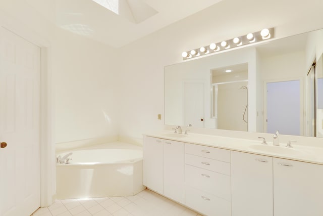17288 Shoals Dr, Jupiter, FL 33477 - bathroom with double vanity, a garden tub, a shower stall, a skylight, and tile patterned floors