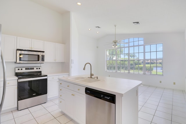 17288 Shoals Dr, Jupiter, FL 33477 - kitchen with stainless steel appliances, lofted ceiling, light tile patterned floors, light countertops, and recessed lighting