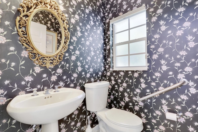 17288 Shoals Dr, Jupiter, FL 33477 - half bathroom with toilet and a sink