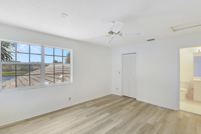 17288 Shoals Dr, Jupiter, FL 33477 - unfurnished bedroom with wood finished floors, a closet, ensuite bath, and a ceiling fan