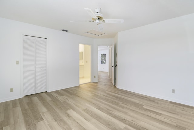 17288 Shoals Dr, Jupiter, FL 33477 - unfurnished bedroom with attic access, light wood-style flooring, and a closet