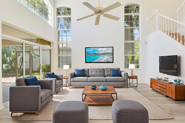17288 Shoals Dr, Jupiter, FL 33477 - living room with a high ceiling, wood finished floors, ceiling fan, and stairs