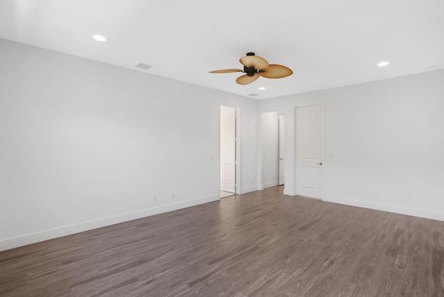 spare room featuring recessed lighting, baseboards, ceiling fan, and dark wood finished floors