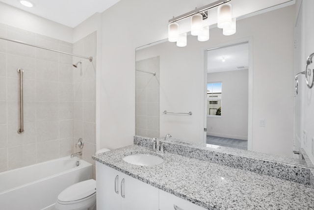 bathroom featuring vanity, shower / bathing tub combination, and toilet