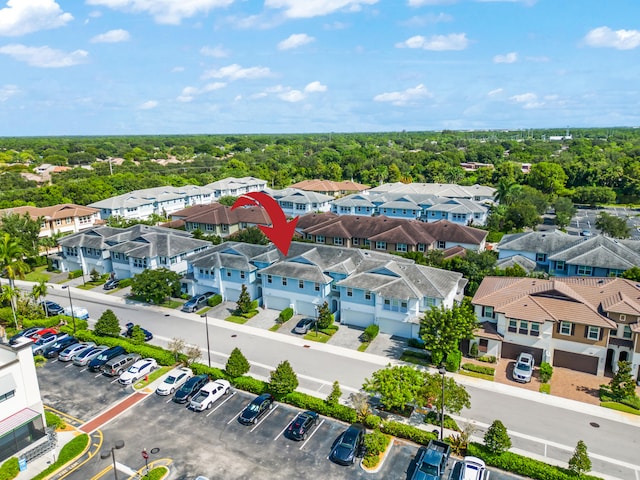 birds eye view of property with a residential view