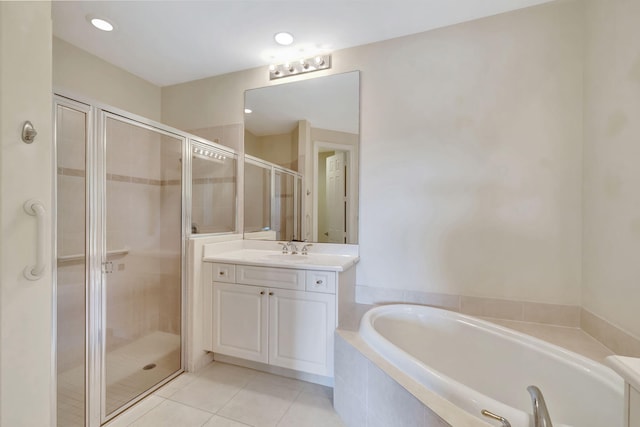 full bathroom with vanity, tile patterned floors, a shower stall, and a garden tub