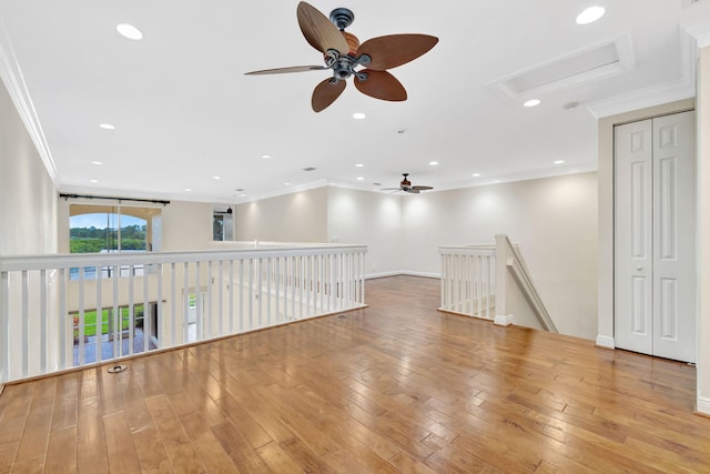 unfurnished room with recessed lighting, ornamental molding, a ceiling fan, and attic access