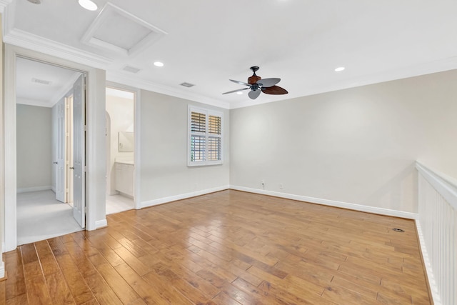 unfurnished bedroom with attic access, visible vents, baseboards, ornamental molding, and light wood-style flooring