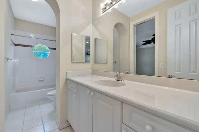 bathroom featuring toilet,  shower combination, tile patterned flooring, and vanity