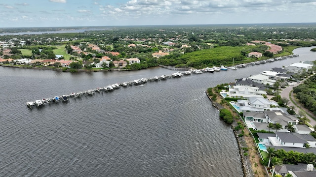 bird's eye view featuring a water view and a residential view