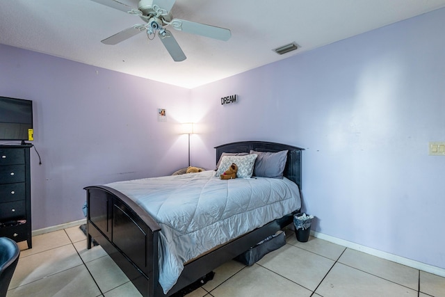 bedroom featuring visible vents, baseboards, ceiling fan, and tile patterned flooring