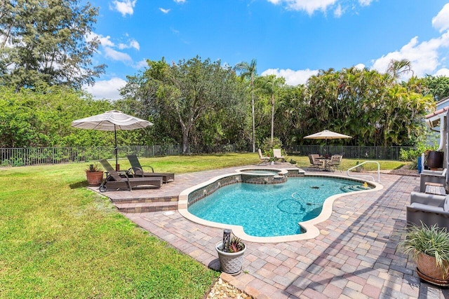 view of swimming pool with a yard, a patio, and a fenced backyard