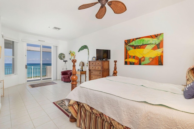 bedroom with access to exterior, light tile patterned floors, and a ceiling fan