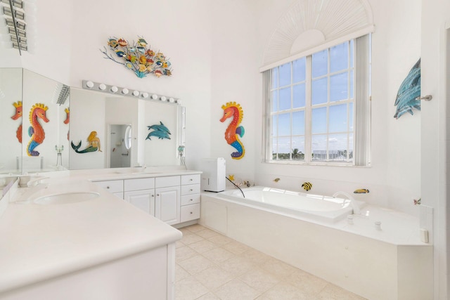 bathroom featuring vanity and a bath