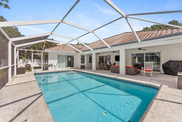 outdoor pool with a patio, ceiling fan, an outdoor living space, a lanai, and a grill