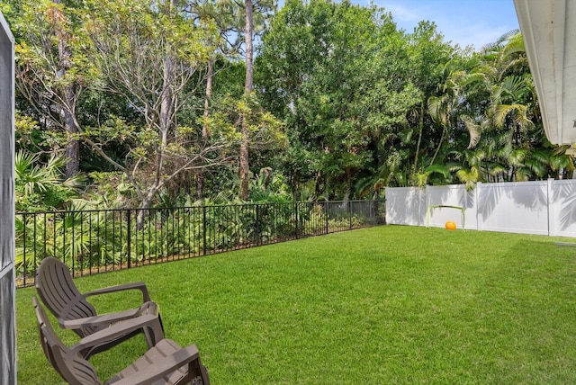 view of yard with a fenced backyard