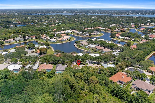 birds eye view of property with a residential view and a water view