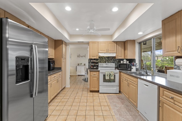 11711 Laurel Valley Cir, Wellington, FL 33414 - kitchen featuring a sink, stainless steel appliances, under cabinet range hood, decorative backsplash, and dark countertops