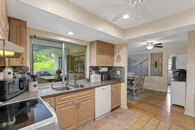 11711 Laurel Valley Cir, Wellington, FL 33414 - kitchen with a sink, ceiling fan, white appliances, and decorative backsplash